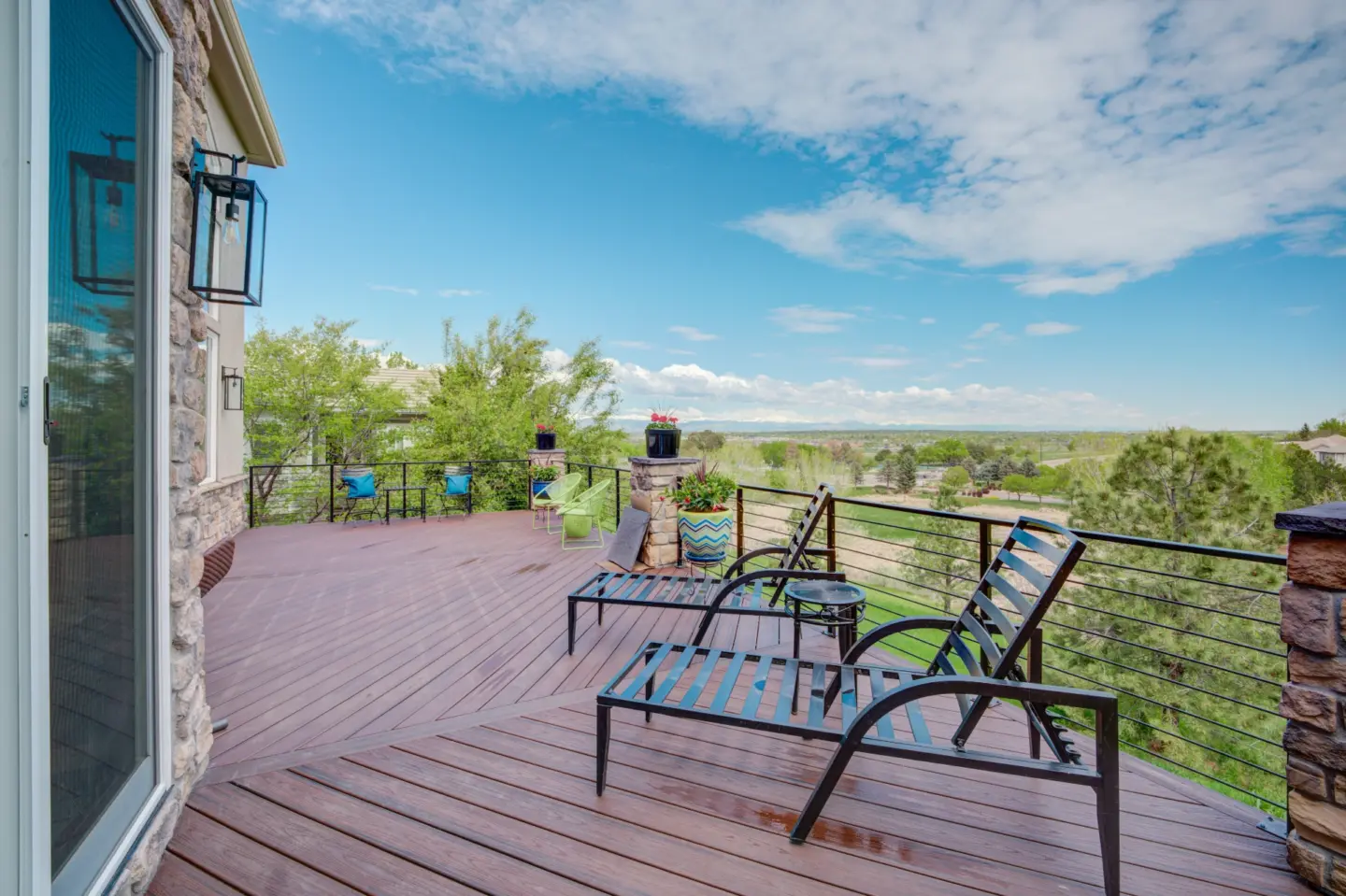 Composite deck with cable railing overlooking an amazing view of the forest
